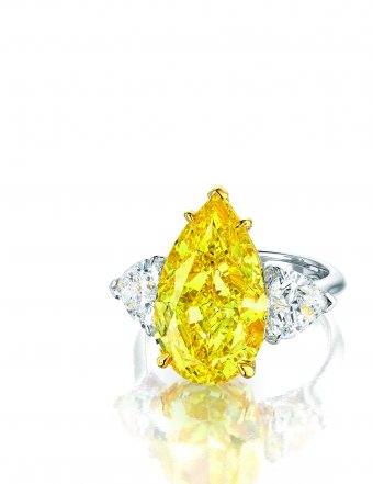 A Very Rare and Superb Internally Flawless Fancy Vivid Yellow Diamond and Diamond Ring, 8.09 carats (Estimate: HKD 5,500,000 - 6,300,000)