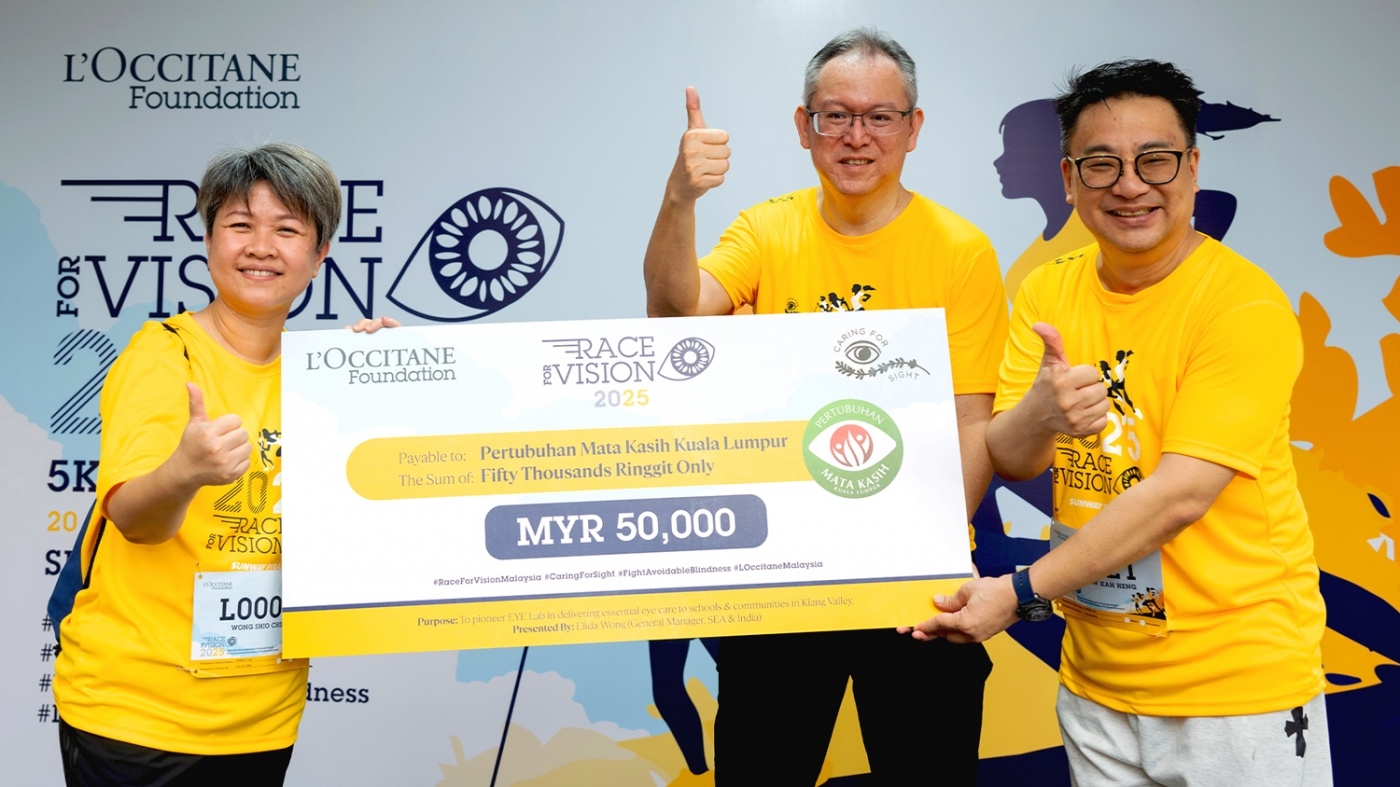 Mock cheque presentation by L’Occitane Top Management Team