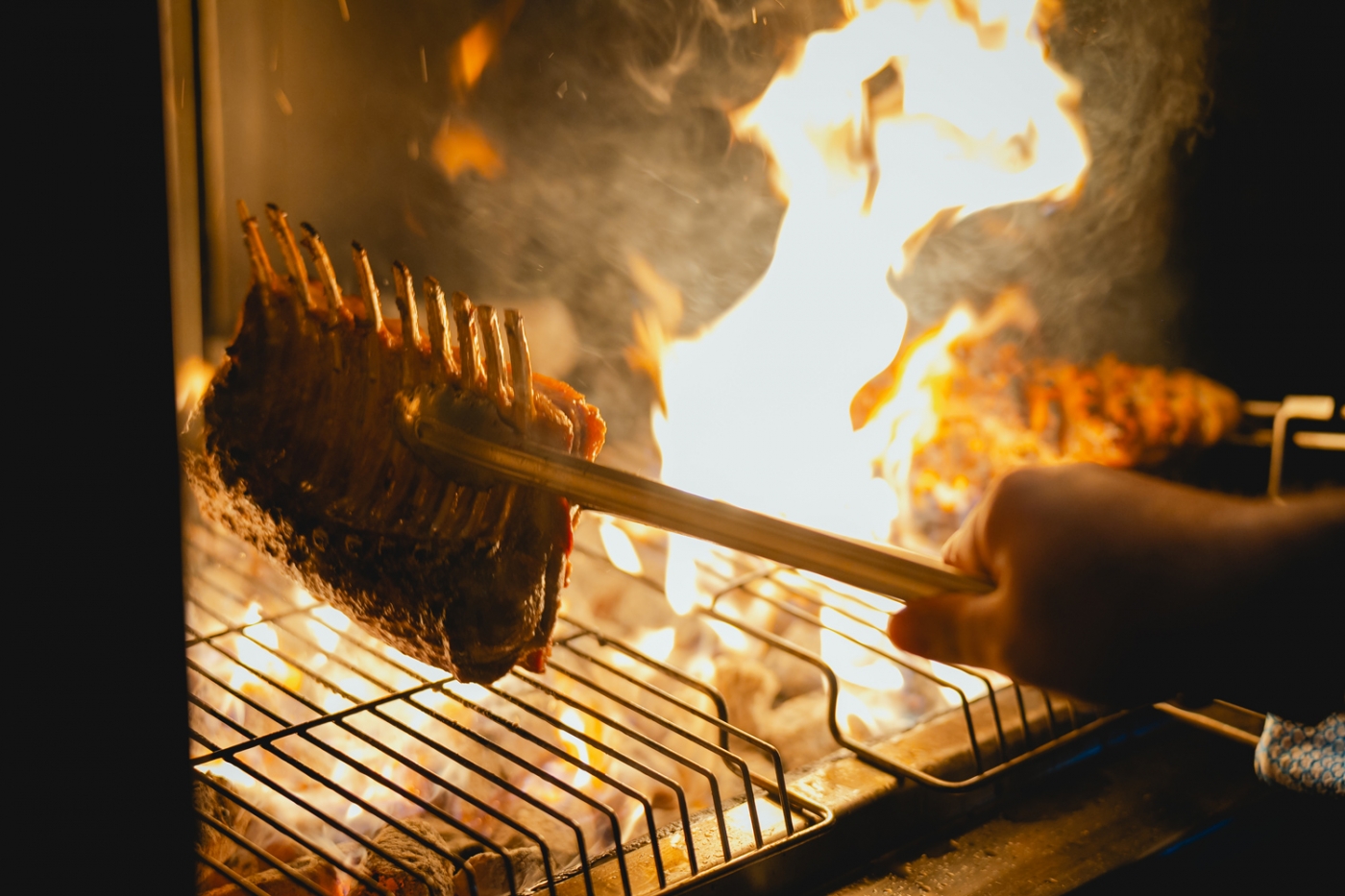 Fire meets finesse: Gundagai Lamb prepared over live flames, allowing its natural marbling to do the work.
